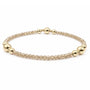 Gold beaded bracelet on a white background