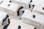 Multiple boxes of Nudie & Co. products on a white background