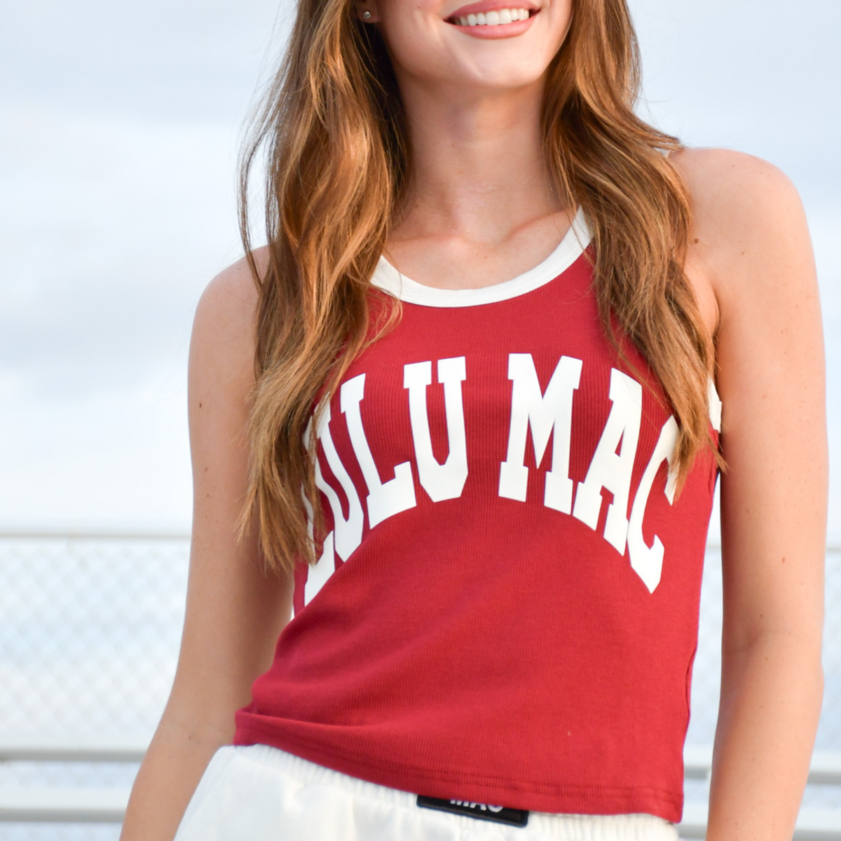 Crimson red sleeveless graphic crop tank top with white trim