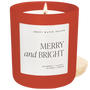 Red candle with a 'Merry and Bright' label on a white background