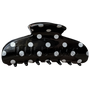 Black hair clip with white polka dots on a white background