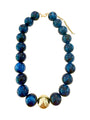 Chunky beaded necklace with dark navy-blue glass beads and gold-tone clasp