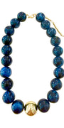 Chunky beaded necklace with dark navy-blue glass beads and gold-tone clasp