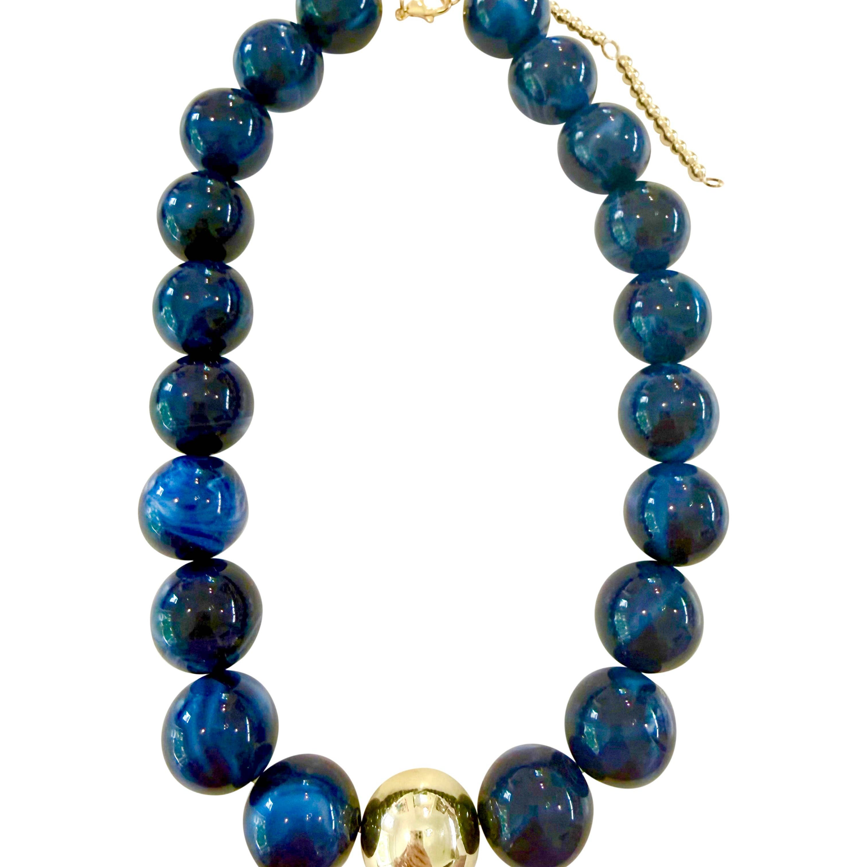Chunky beaded necklace with dark navy-blue glass beads and gold-tone clasp
