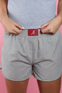 Grey woven shorts with elastic waistband and red A logo patch