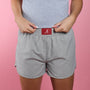 Grey woven shorts with elastic waistband and red A logo patch