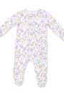 A baby footed sleeper with long sleeves and legs, featuring an all-over print of light brown deer and purple flowers on a white background.