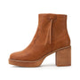 Brown ankle boot with block heel on a white background