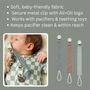 Three linen pacifier clips with metal clasps and white loop ties