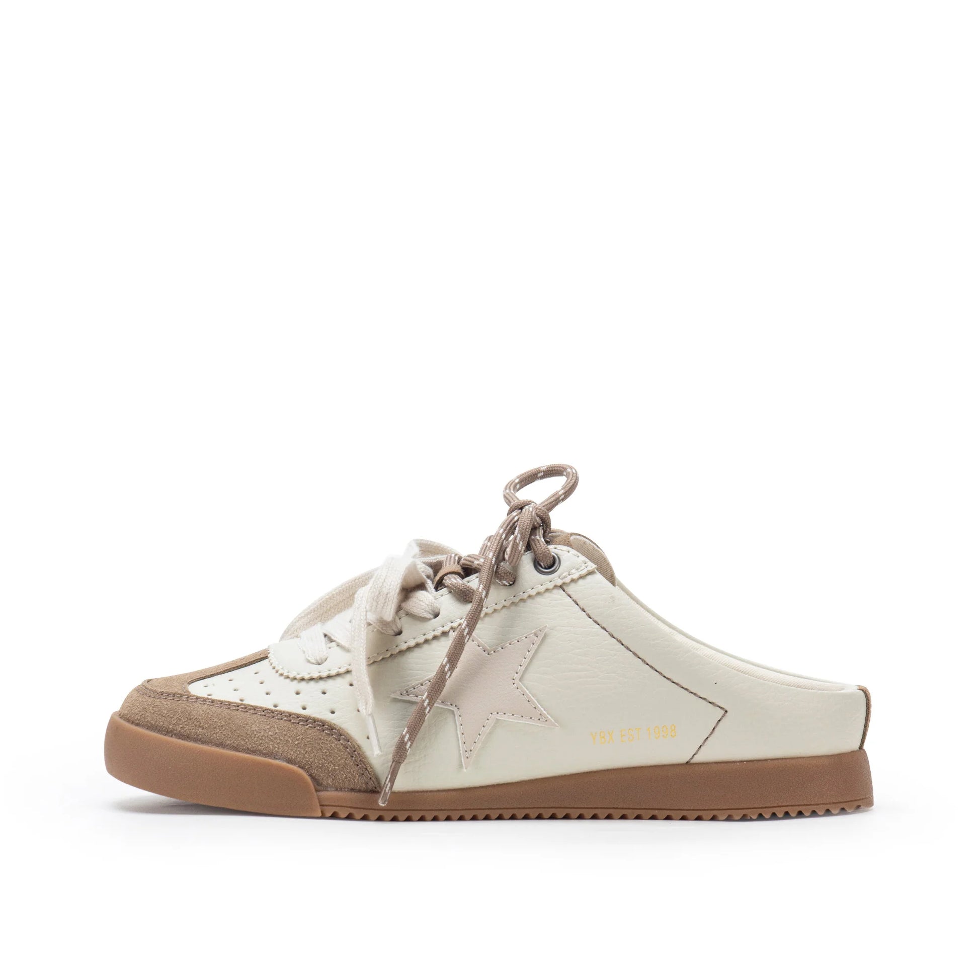 A low-top slip-on sneaker in off-white and light brown, featuring a star-shaped side detail, matching laces, and a gum sole, shown against a plain white background.