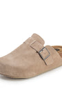 Beige clog shoe with a buckle on a white background