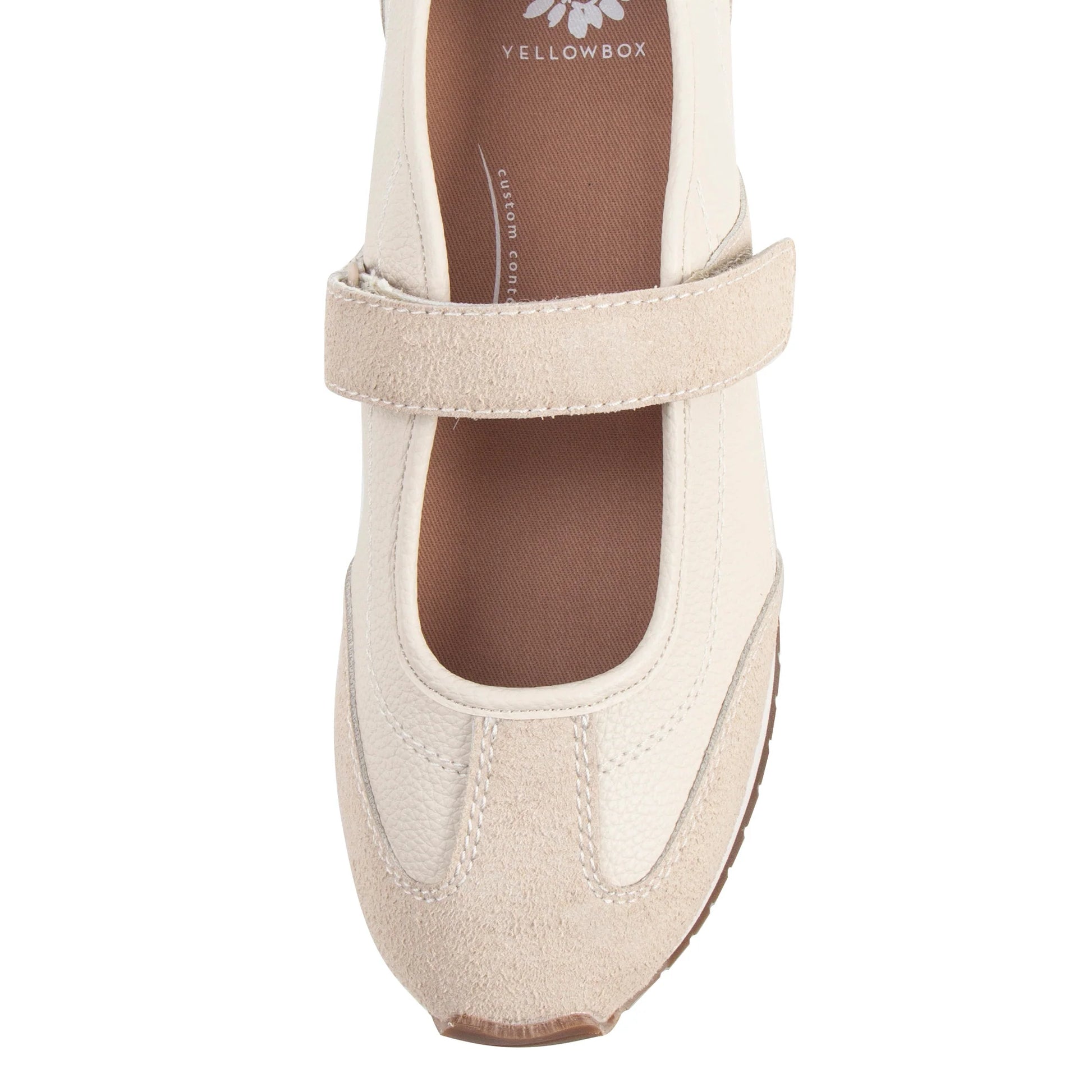 A single cream-colored Mary Jane shoe with a hook-and-loop strap, shown from a top-down view on a white background. The brand name 'YELLOWBOX' is visible on the insole.