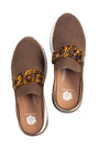 Brown loafers with chain details on a white background