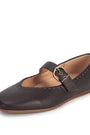A dark brown leather Mary Jane flat shoe with a decorative strap and a gold-tone buckle, shown from a three-quarters angle on a white background.