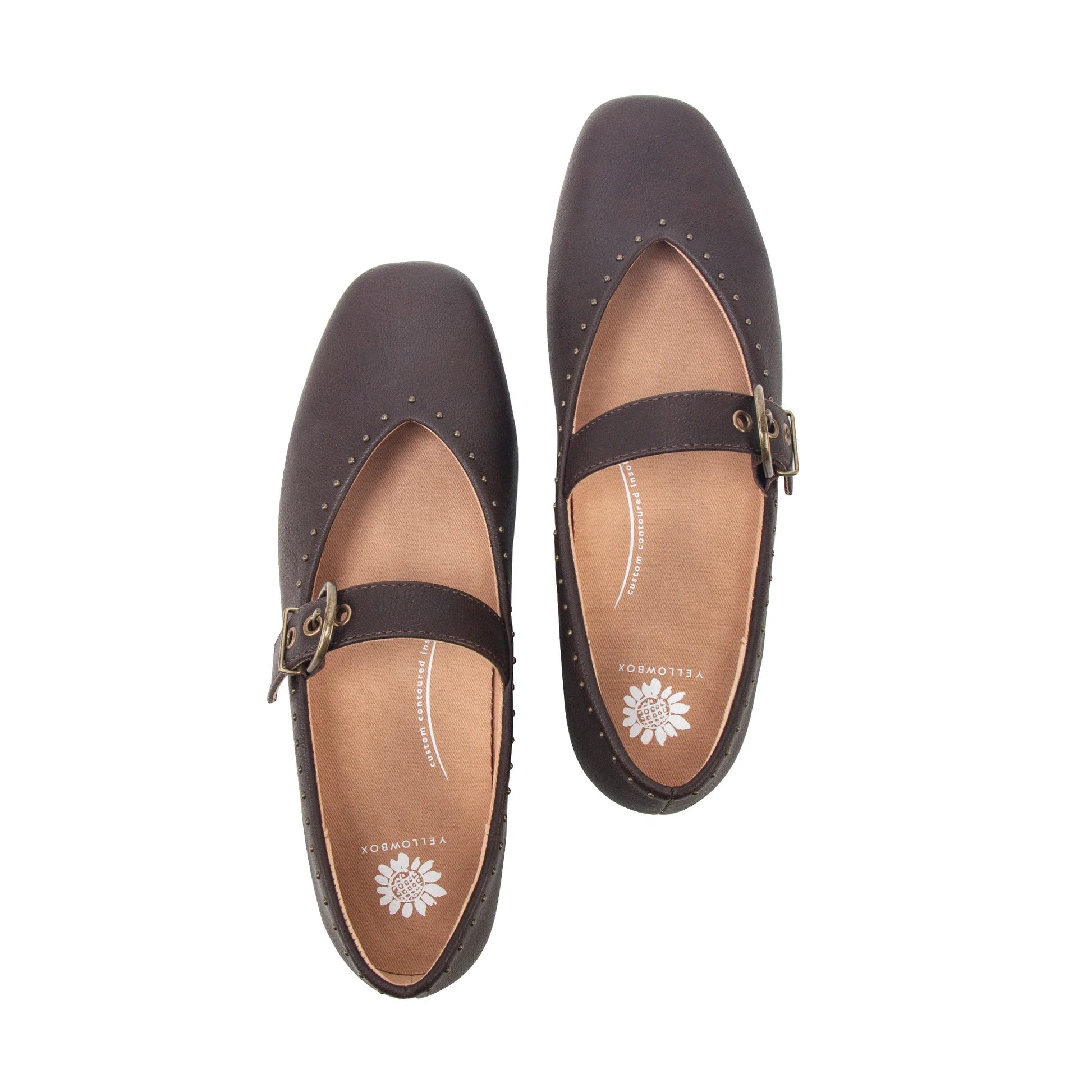A pair of dark brown leather Mary Jane flats with square toes, studded edges, and buckle straps, shown from a top-down view on a white background.