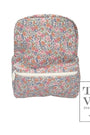 Floral patterned backpack with 'TRVL Design' logo on a white background