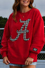 Crimson crewneck sweatshirt with houndstooth letter A graphic and Lulu Mac cuff patch