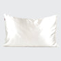 White satin pillowcase on a light gray background