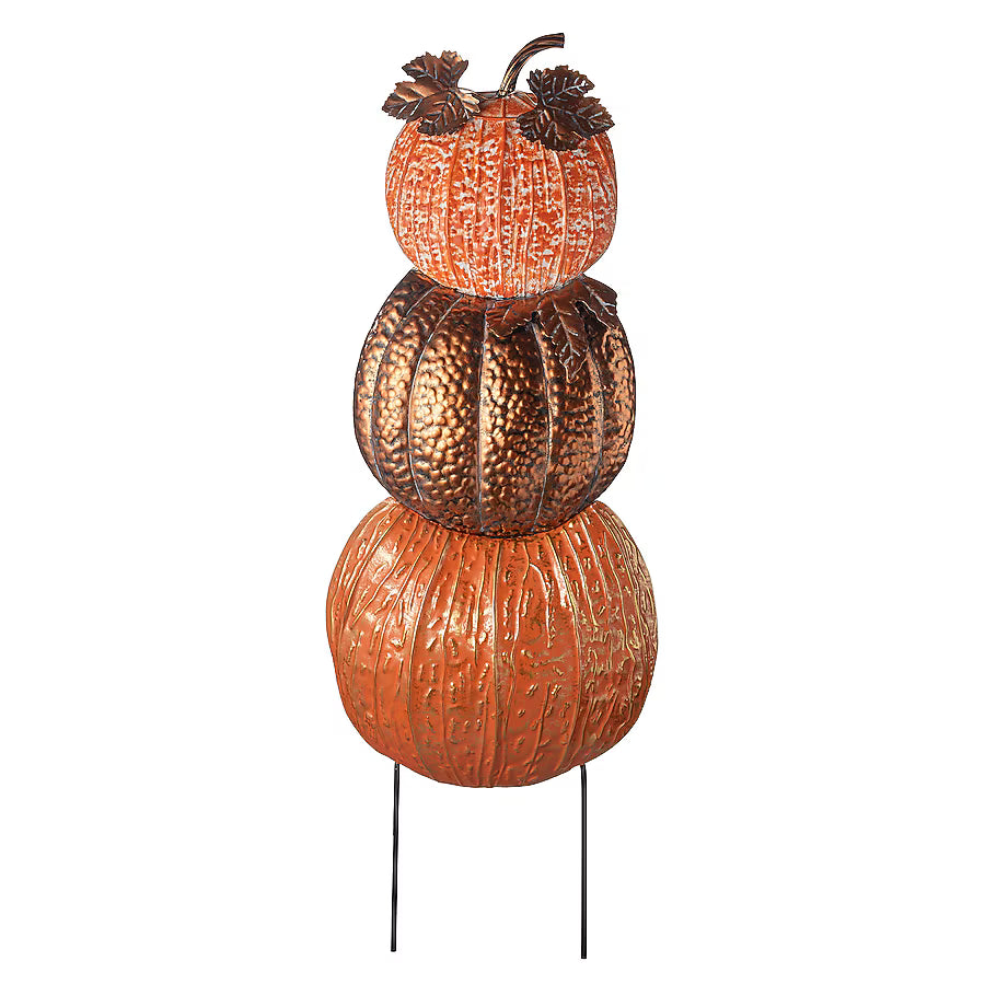 A decorative stacked pumpkin garden stake featuring three textured pumpkins in orange and metallic bronze tones on thin black metal stakes, isolated on a white background.