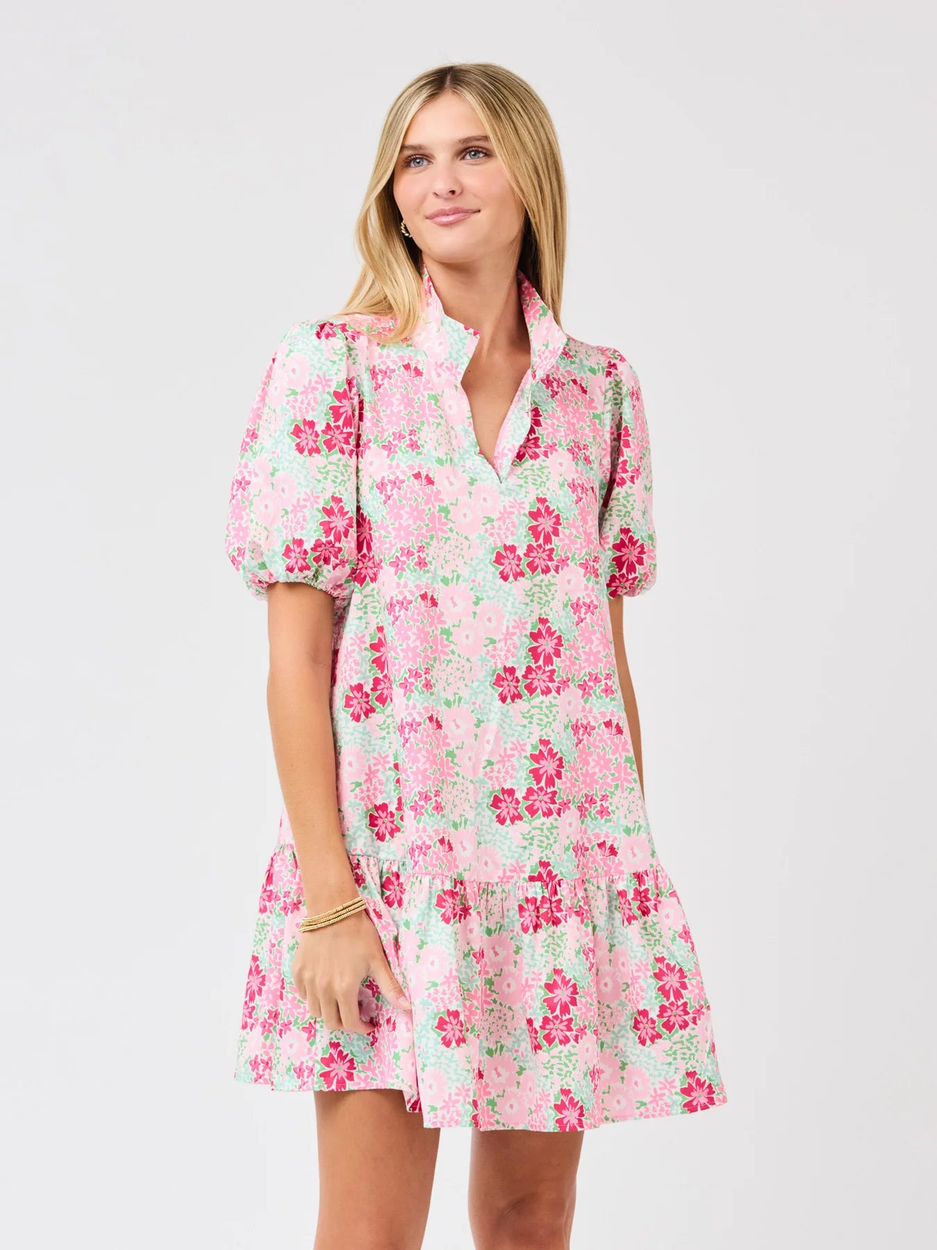 Woman wearing a floral dress on a white background