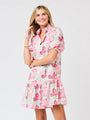 Woman wearing a floral dress on a white background