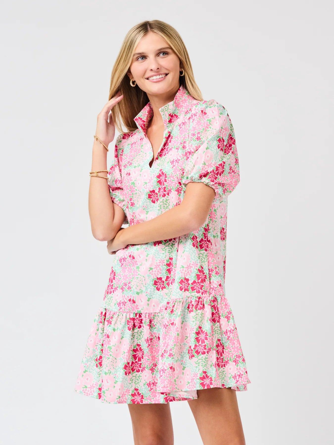 Woman wearing a floral dress on a white background