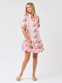Woman wearing a pink floral dress on a white background