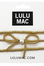 Gold hair bow with pearl center on Lulu Mac packaging