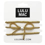 Gold hair bow with pearl center on Lulu Mac packaging