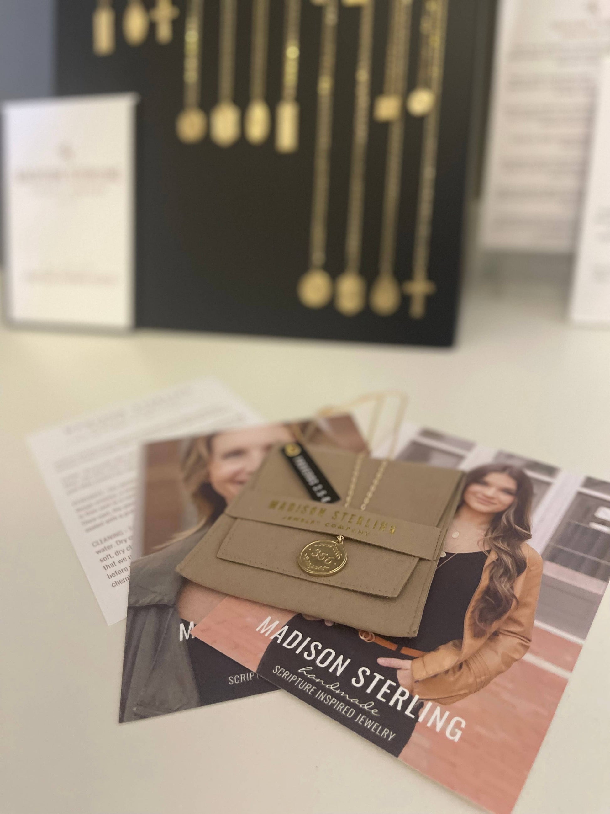 Brown board on a magazine with 'Madison Sterling' branding in the background.