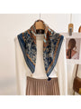 Navy retro floral square scarf with tassels and decorative border, draped on display
