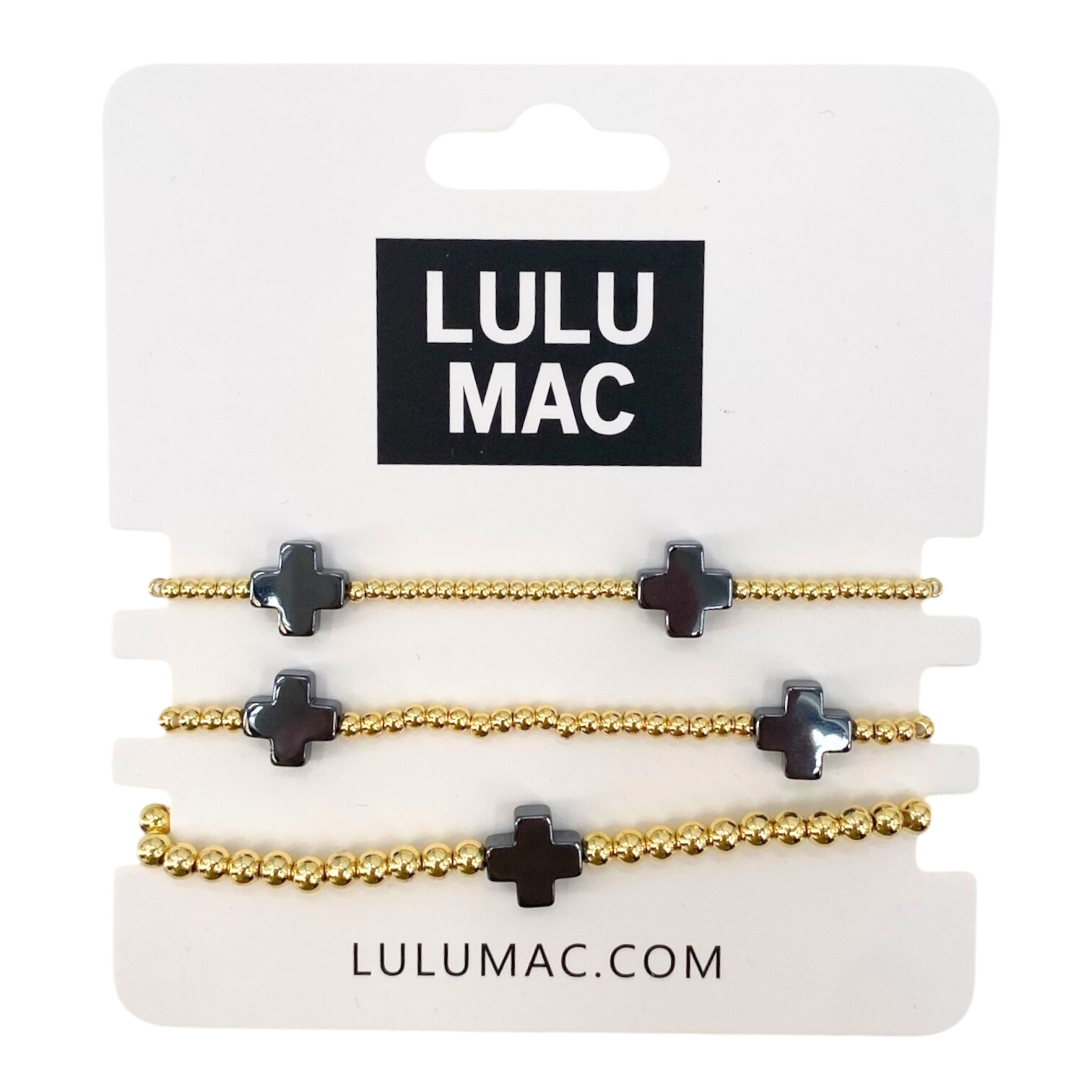 Set of gold and black hair ties on a Lulu Mac packaging card.