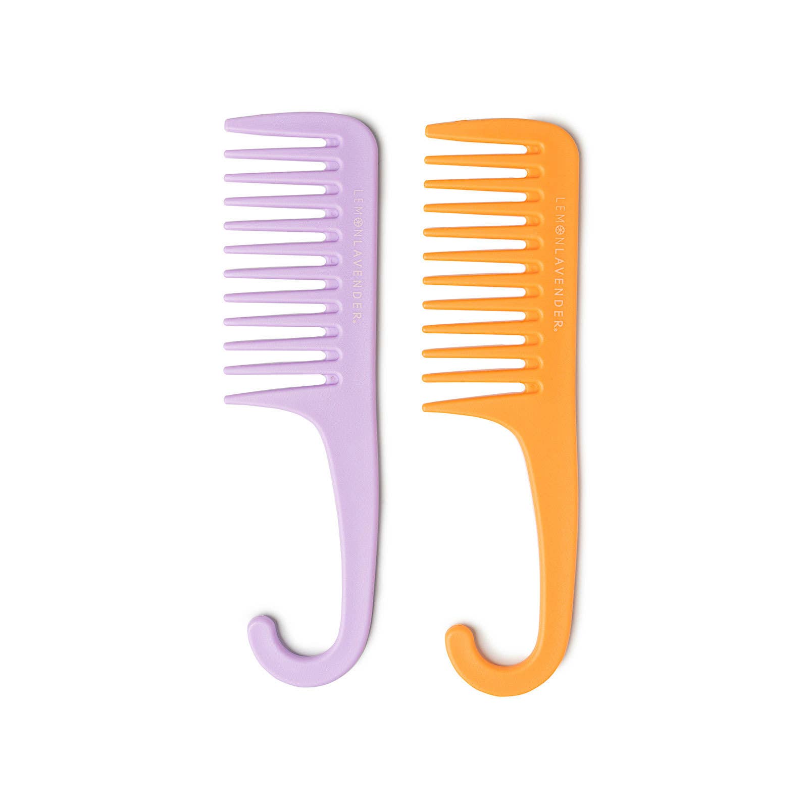 Two combs, one purple and one orange, on a white background