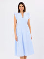 Woman wearing a light blue dress on a white background