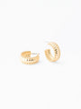 Gold hoop earrings on a white background