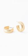 Gold hoop earrings on a white background