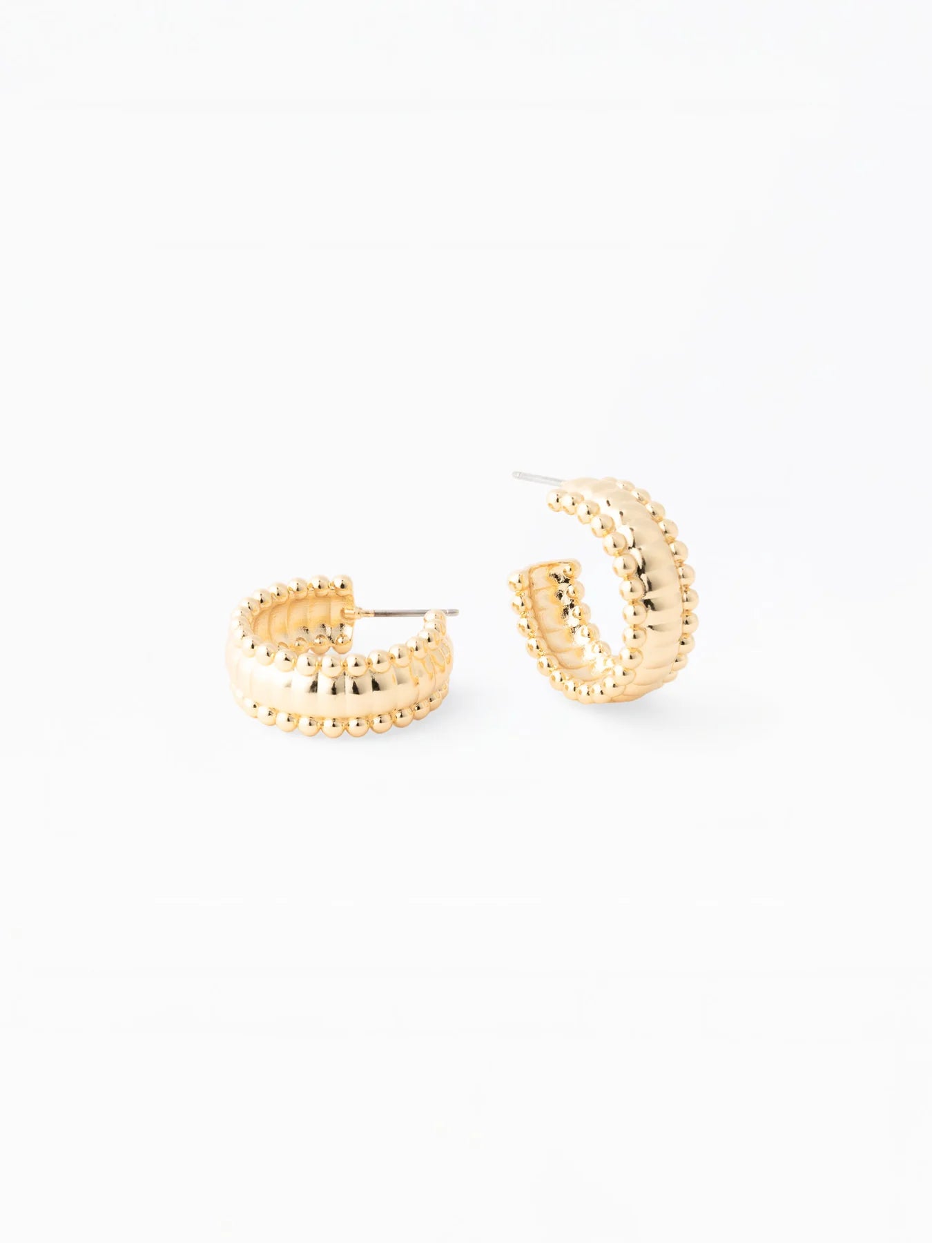 Gold hoop earrings on a white background