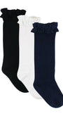 Three pairs of socks in black, white, and navy with ruffled tops on a white background.