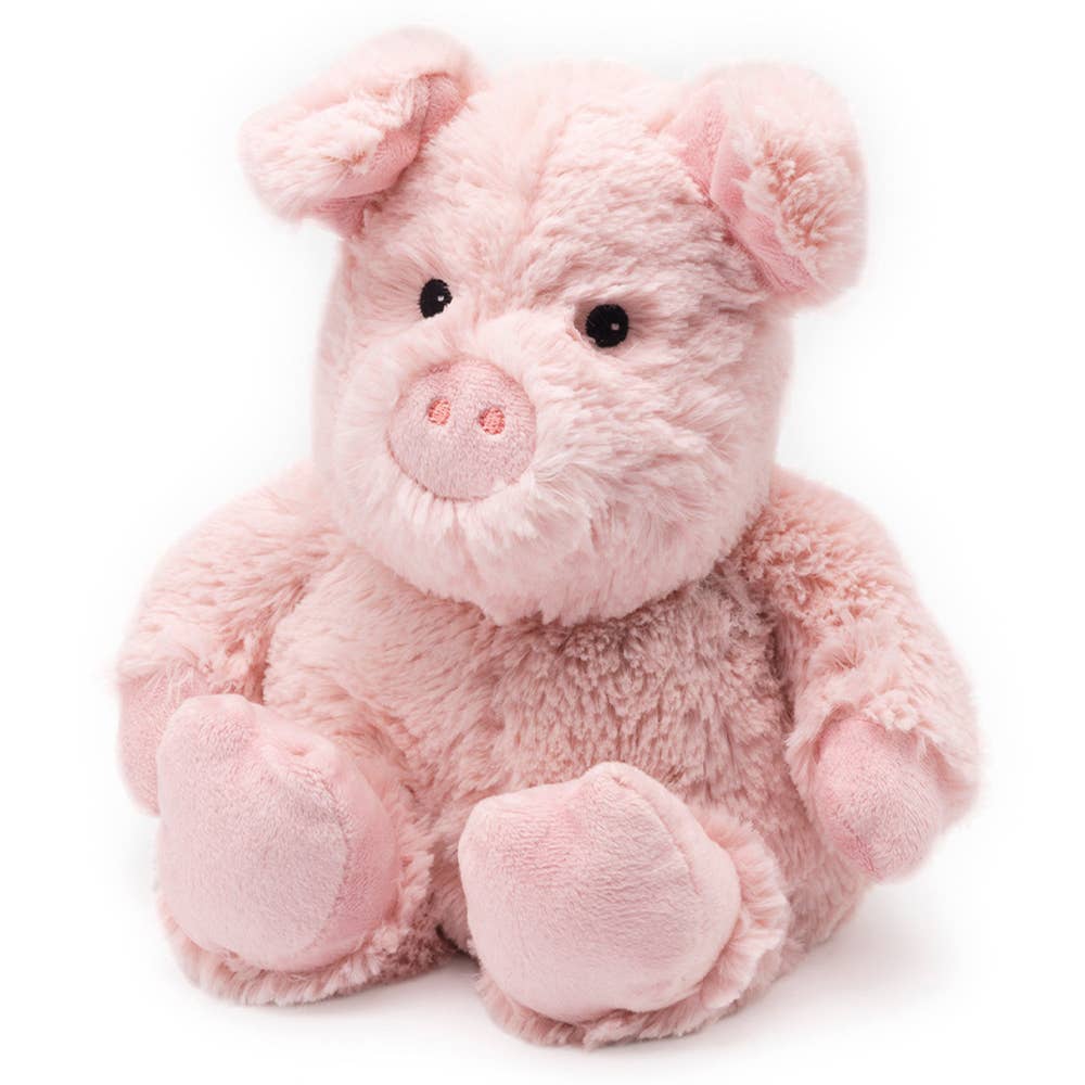 Pink plush pig toy on a white background