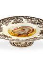 Decorative ceramic plate with a turkey design on a white background