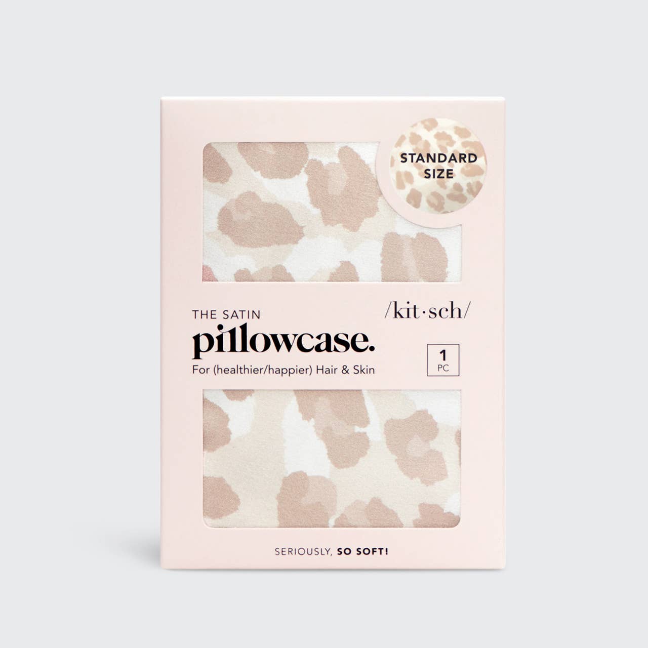 Packaging of a satin pillowcase with leopard print design on a light gray background