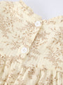 Floral patterned fabric with white buttons on a light background