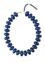 Chunky beaded necklace with dark navy oval beads and gold clasp