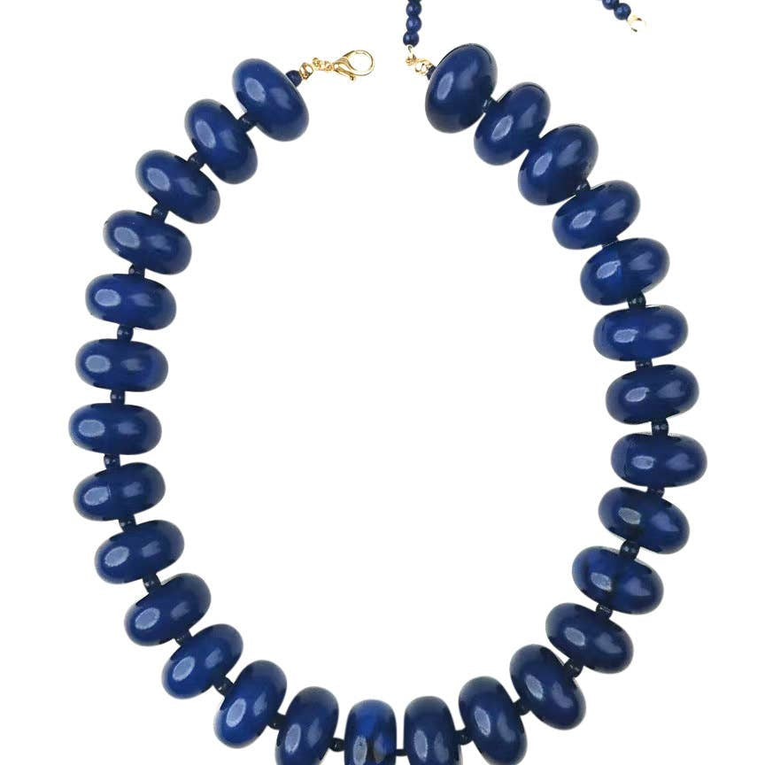 Chunky beaded necklace with dark navy oval beads and gold clasp