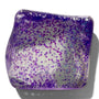 Glass coaster with purple and white speckled pattern on a white background