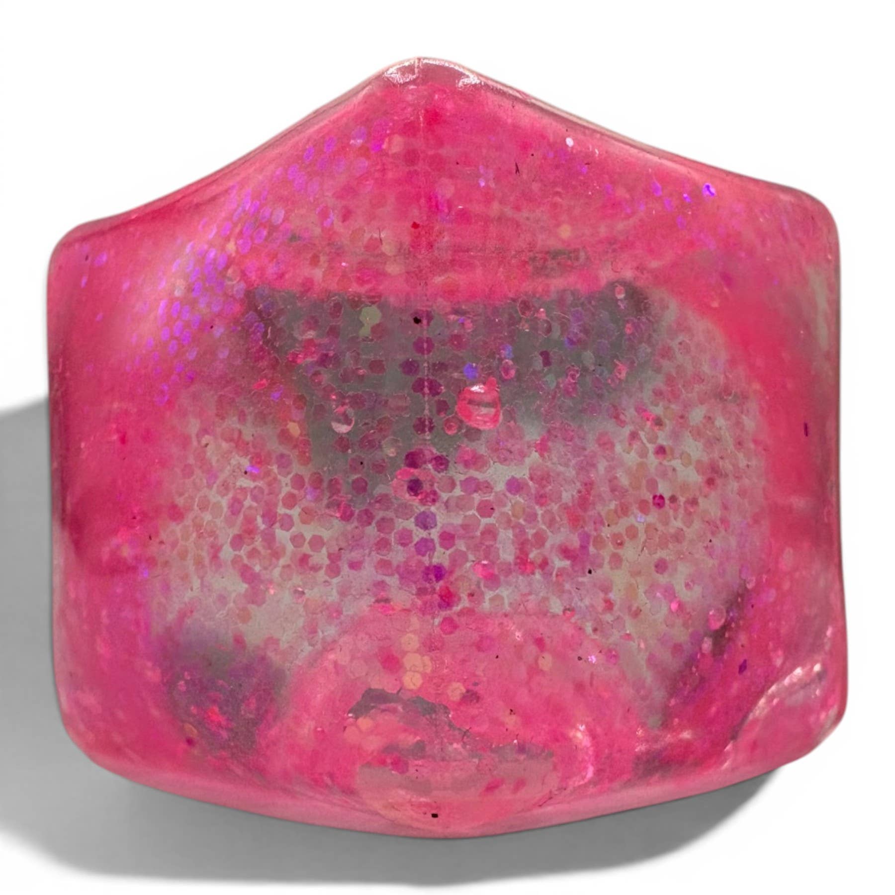 Pink glittery cube on a white background