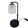 Black table lamp with a white cylindrical shade on a white background