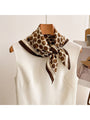 Coffee brown retro dot square scarf wrap with dark border, worn at neckline