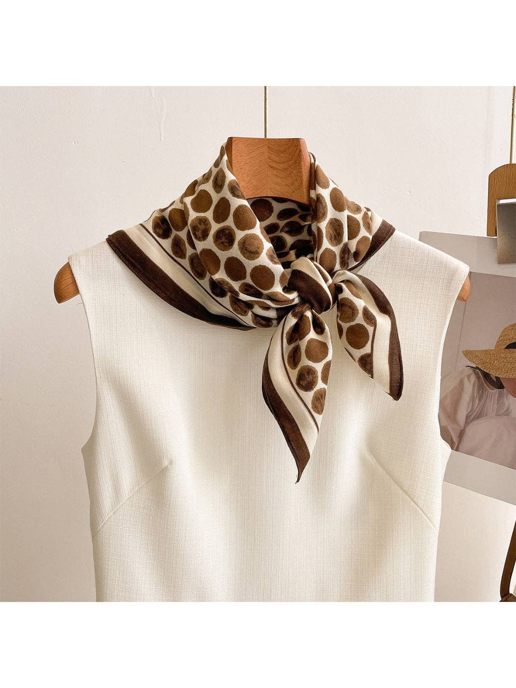 Coffee brown retro dot square scarf wrap with dark border, worn at neckline