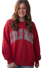 Person wearing a red sweatshirt with text on a white background